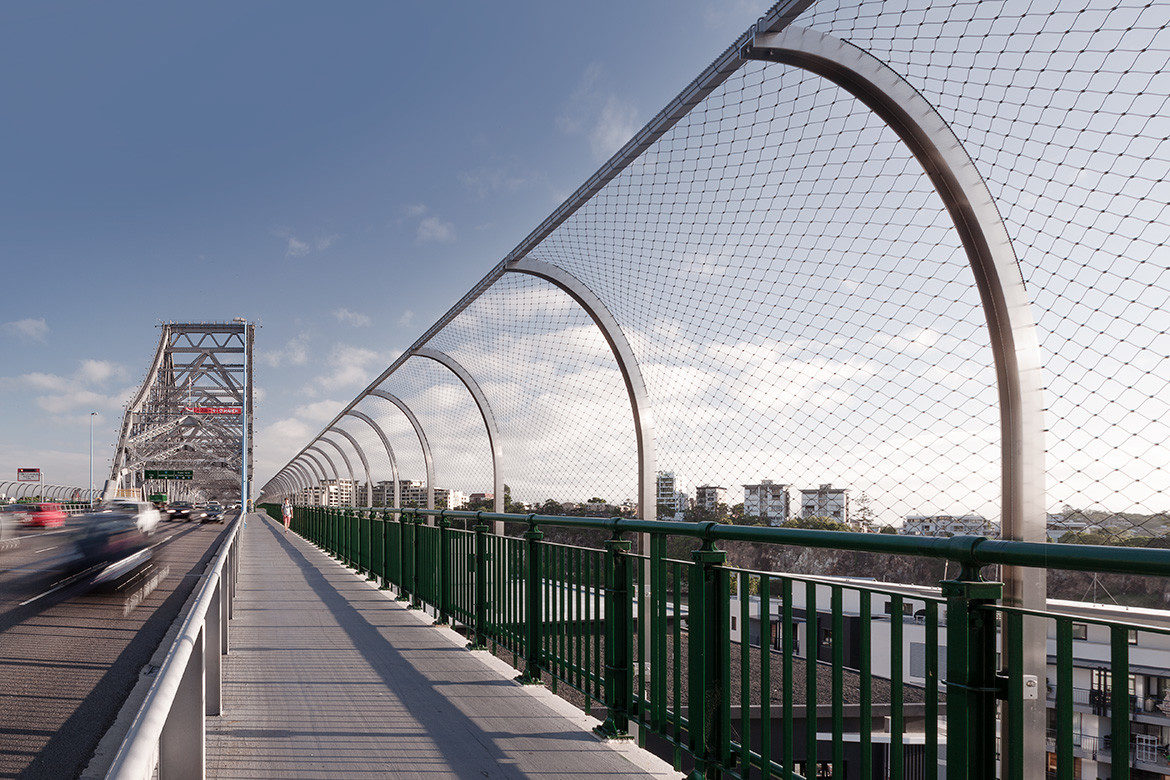 Held together by function and aesthetics: tensile mesh barriers and facades